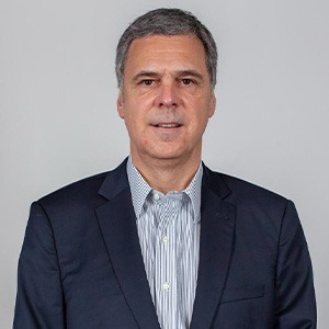 man in grey button up and dark blue sport coat