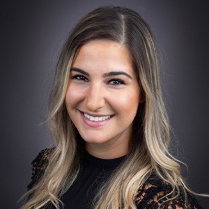 woman in black shirt smiling