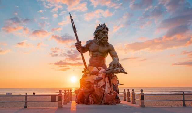 statue of man surrounded by sea creatures