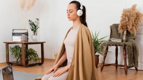 woman meditating in her home
