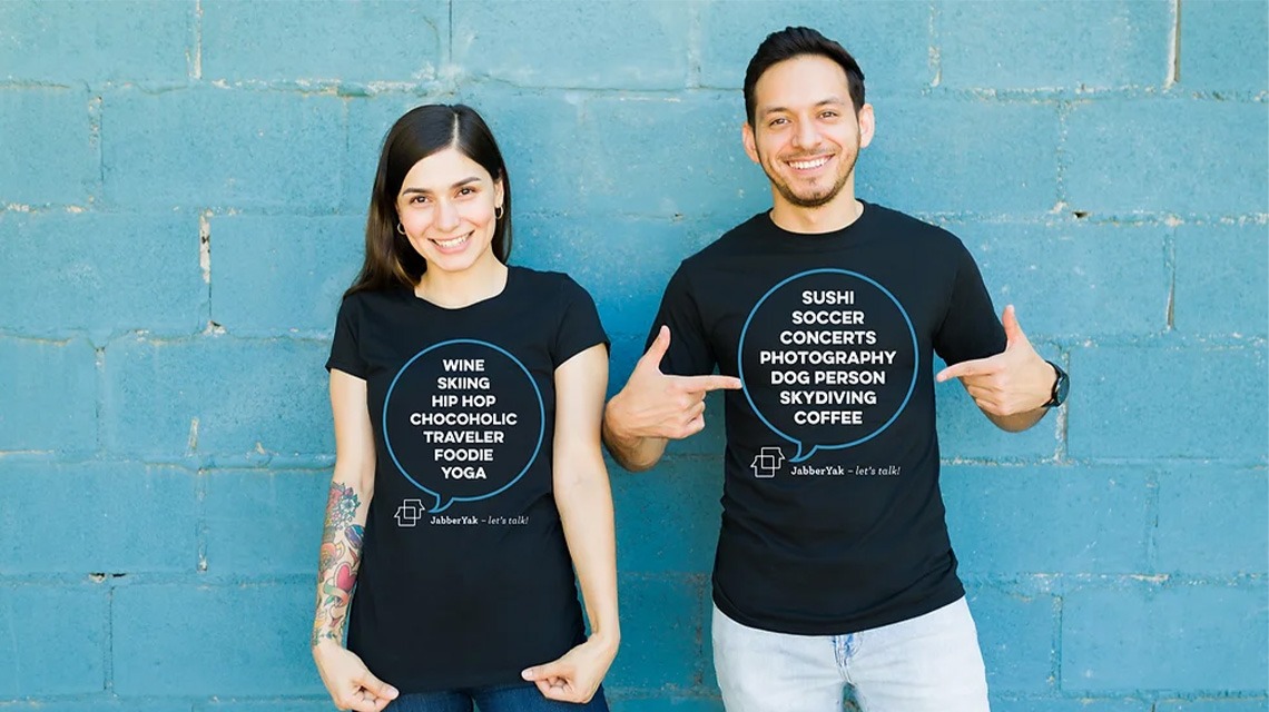 two people pointing at black shirts