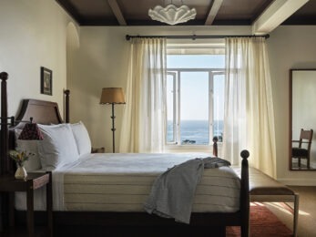 guest room with water view outside window