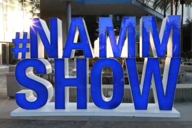 blue sign that reads "#nammshow"