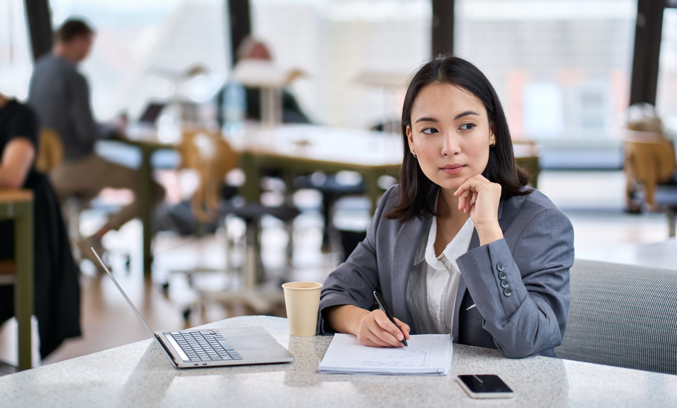 businesswoman sitting in front on laptop