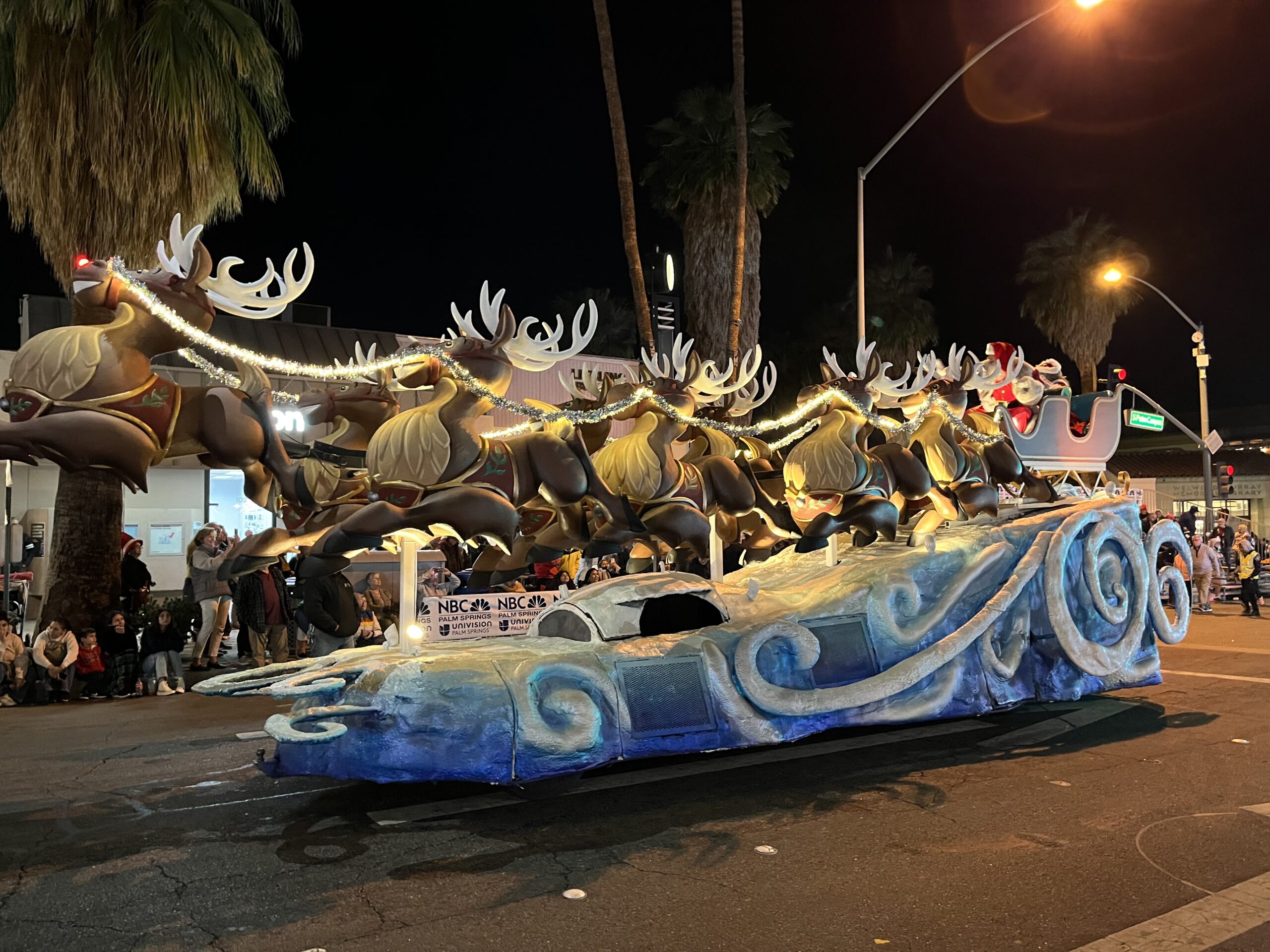 reindeer and santa float at 2023 Festival of Lights Parade in Palm Springs, California