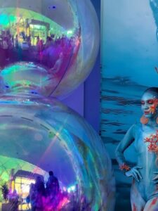 Decorative blue bubbles and woman with coral