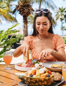 woman eating food at SheratonMaui Resort & Spa