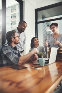 four businesspeople meeting in room