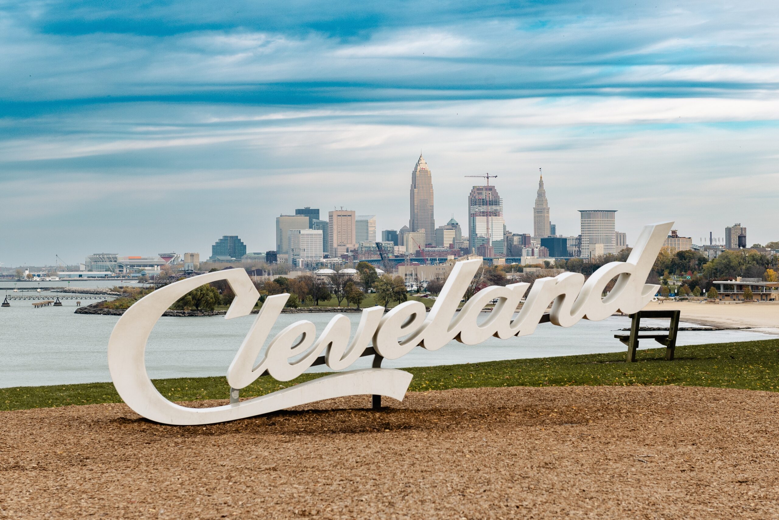 Cleveland Script sign at Edgewater park with city skyline in the background