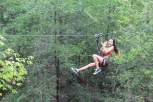 woman ziplining at Orlando Tree Trek