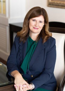 Anne Marie Doyle wearing green shirt and blue jacket