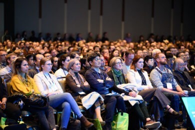 group in ballroom listening to keynote