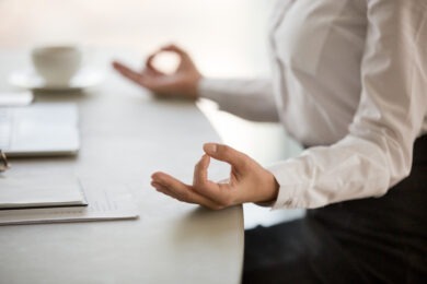 Woman meditating at work