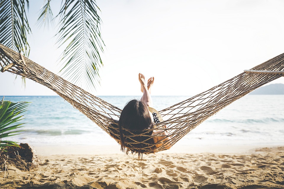 woman in hammock at beach