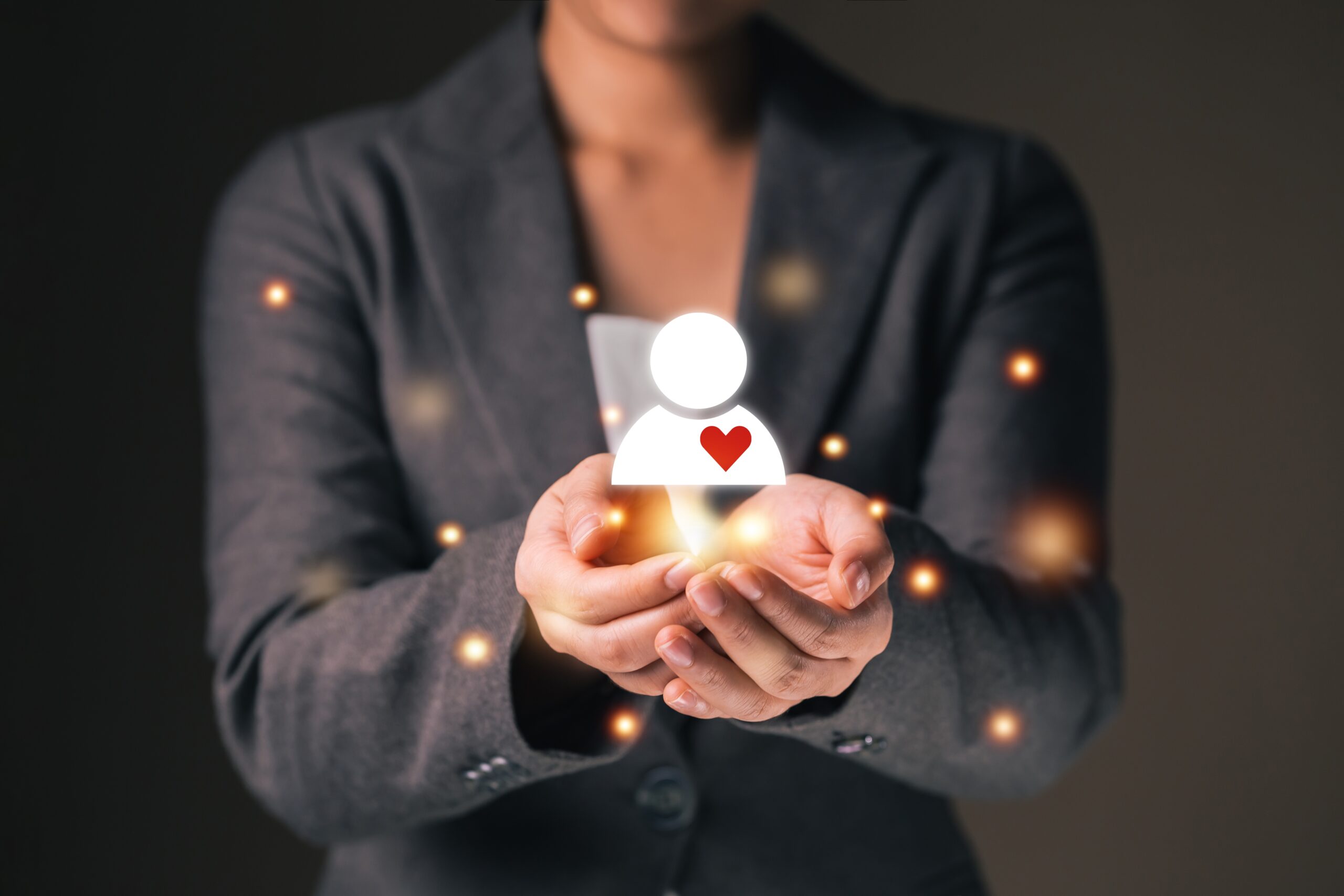 illustrated figure hovering over businesswoman's hands