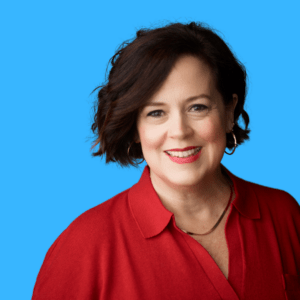 Natasha Miller wearing red dress shirt against blue background