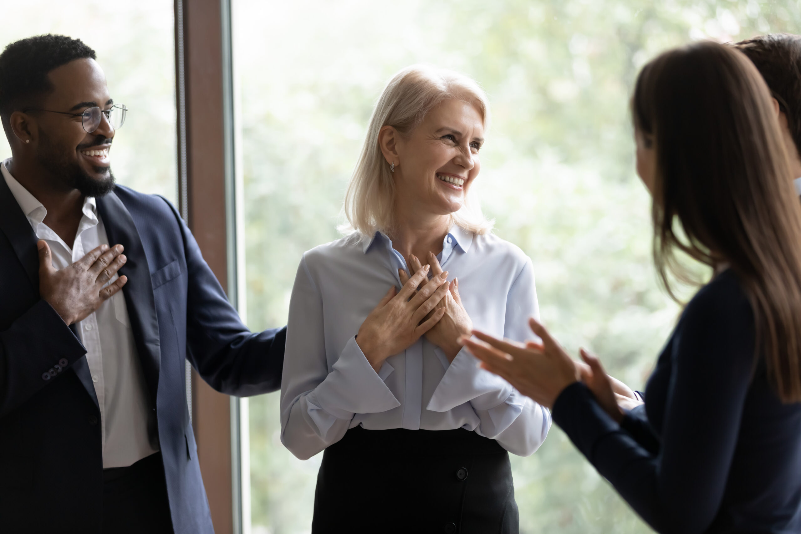 Businesswoman gets cheers from colleagues