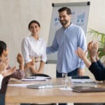 Leadership supporting their employee with fellow coworkers