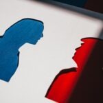 Papercut Silhouettes of Kamala Harris and Donald Trump in Blue and Red