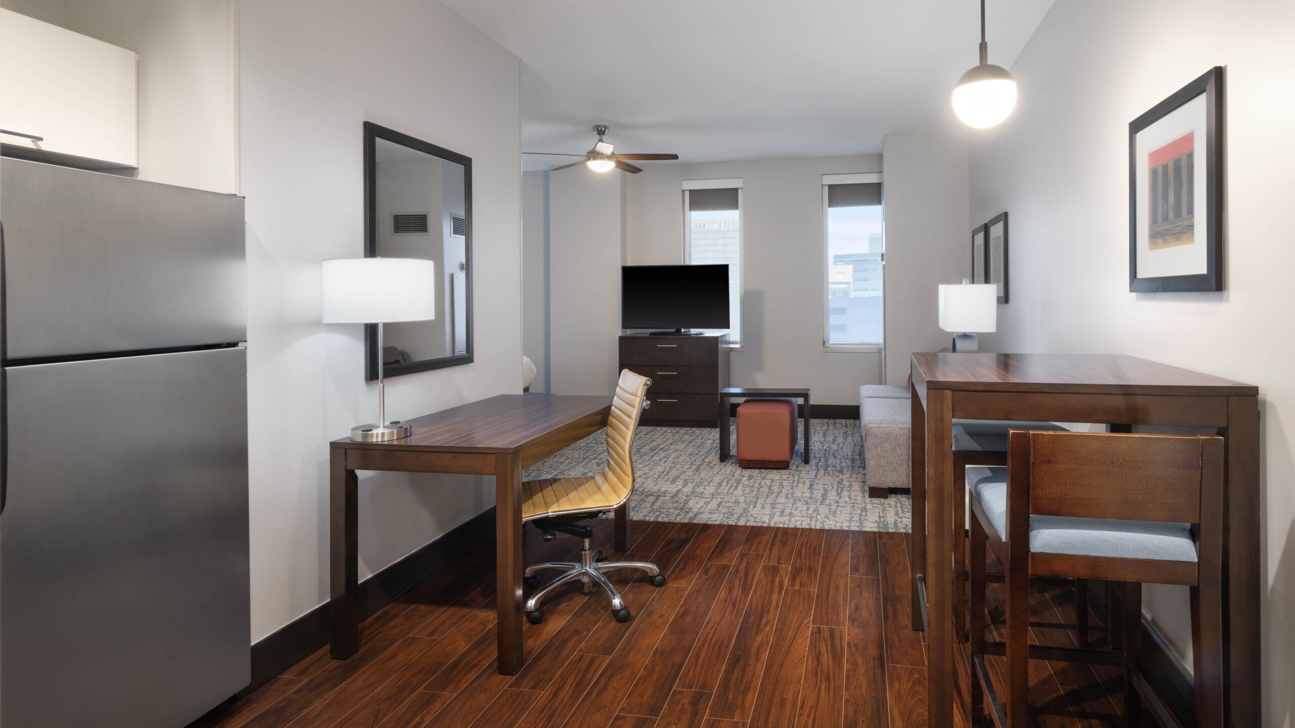 Guest suite for new and renovated Hometown Suites by Hilton Denver Downtown-Convention Center and Hampton Inn & Suites Denver Downtown-Convention Center