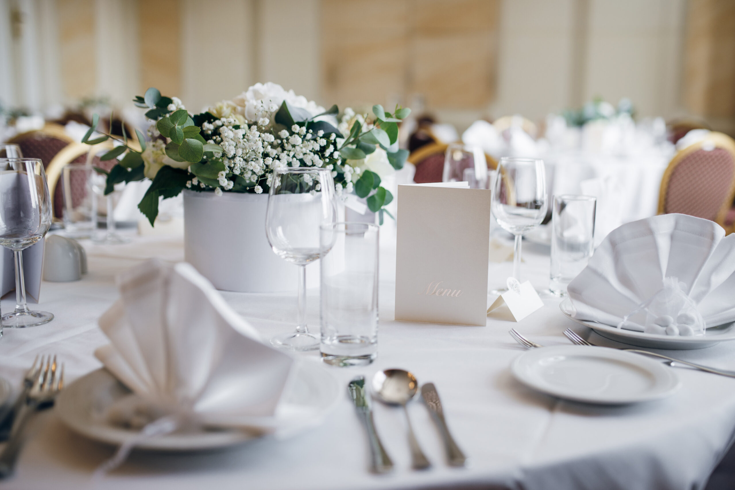 table set with flowers and eating utensils