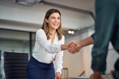 businesswoman shaking hands with someone