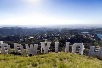 The iconic Hollywood sign under a radiant blue sky