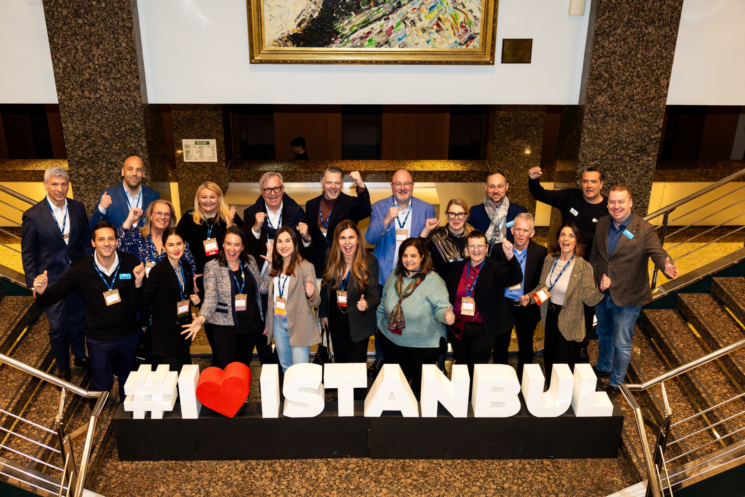 People standing behind sign that reads "I Love Istanbul"