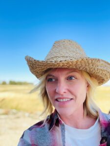 Anna Schmid wearing red flannel and cowboy hat