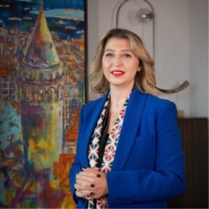 Dr. Elif Balci Fisunoglu in blue coat