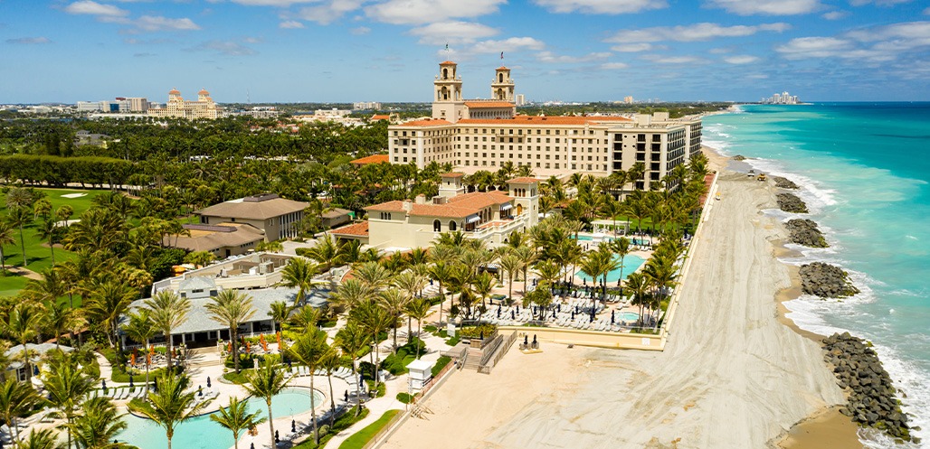 Aerial shot of The Breakers property next to beach