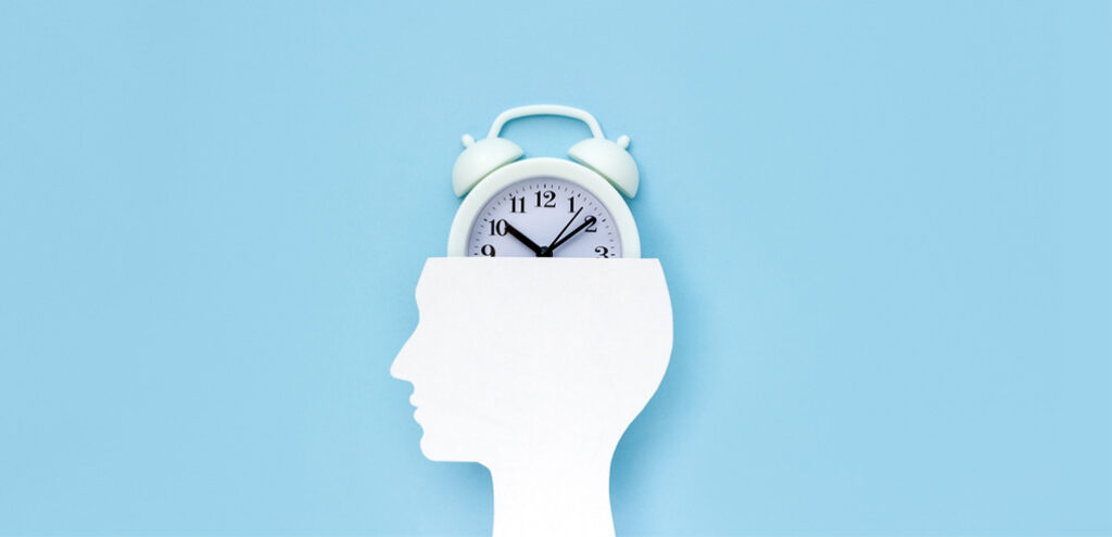 Illustration of human head with alarm clock