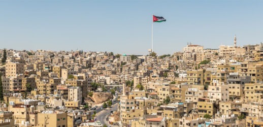 Buildings and Jordan flag in Amman, Jordan