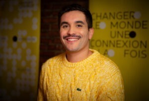 Adrien Tombari wearing yellow long sleeve shirt