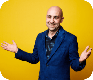 Dan Gangiss in blue sport coat on yellow background