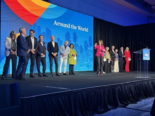 Group of international representatives on stage at Visit California Outlook Forum