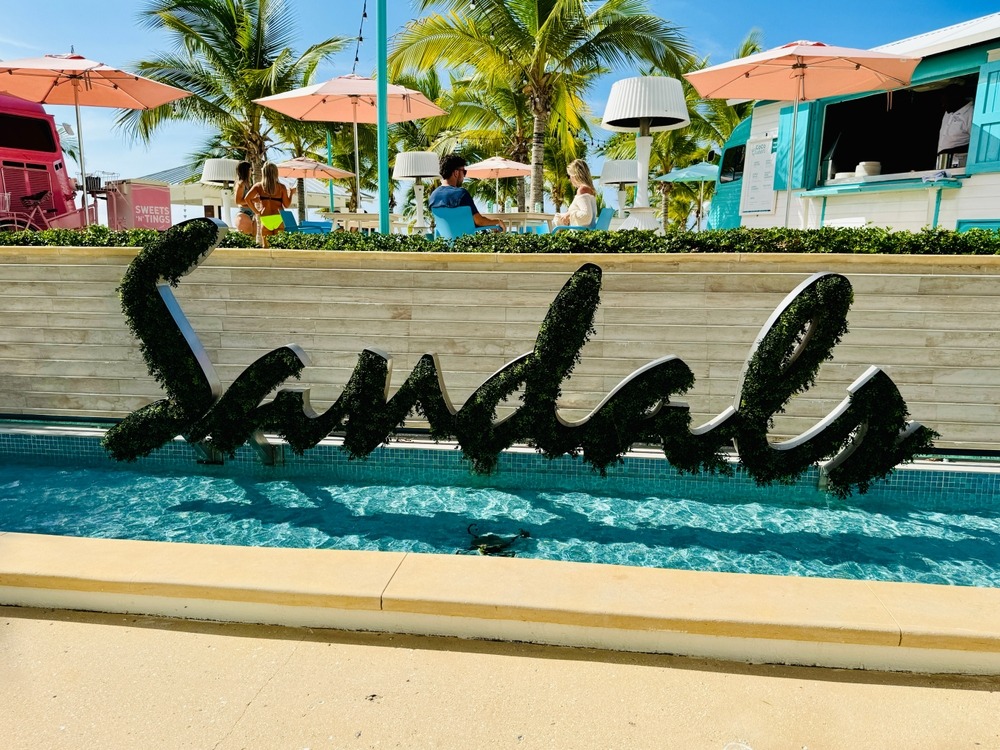 Fountain and Sandals sign in The Royal Bahamian Sandals Resort in Nassau, Bahamas